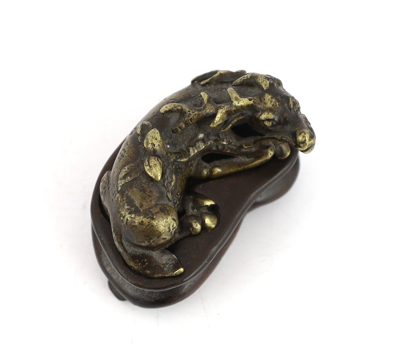 A Chinese bronze weight, in the form of a recumbent deer, late Ming/early Qing dynasty